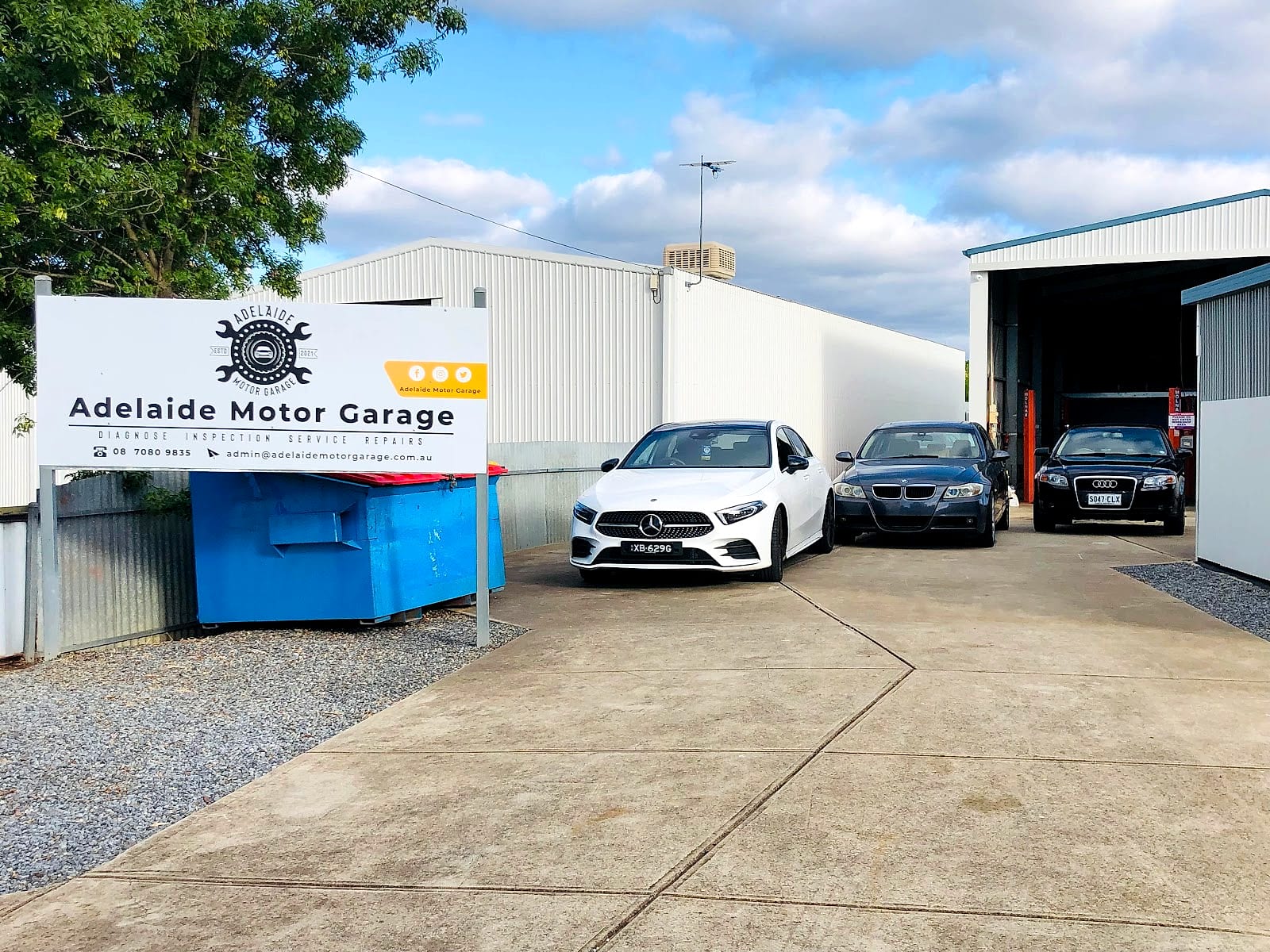 The Adelaide Motor Garage shopfront on Katrina Avenue with cars parked out front